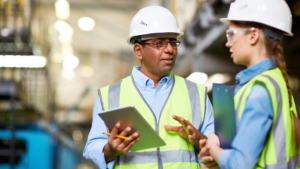 factory workers in hard hats