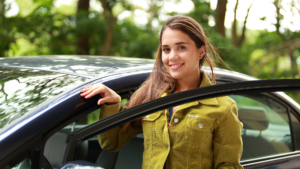 a teenager getting into a car